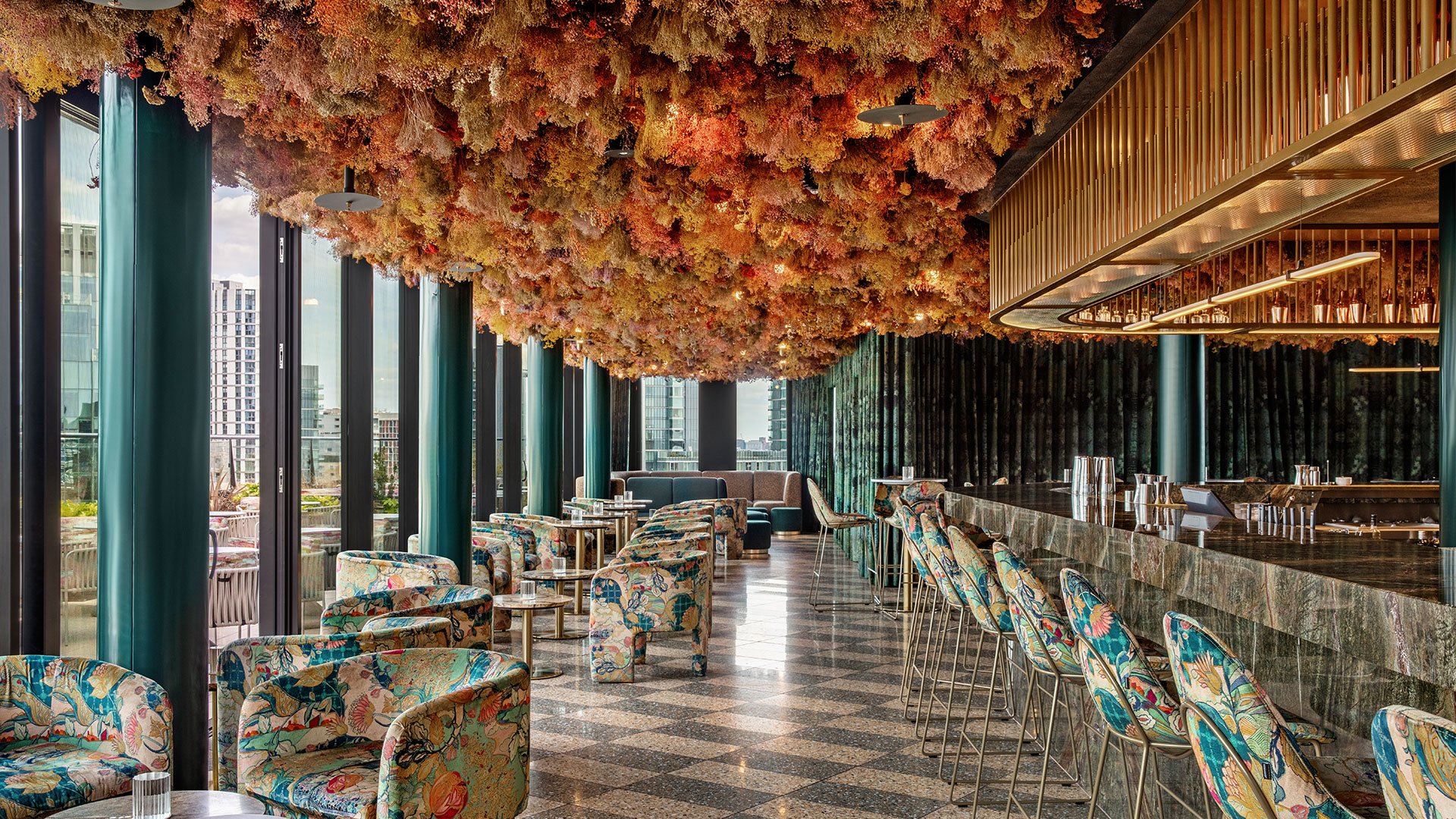 Floral upholstered banquette seating at Florattica rooftop bar