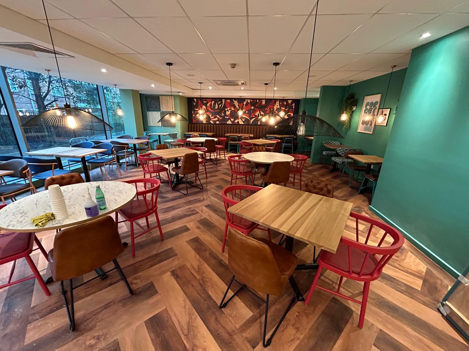 Travelodge Bar Café banquette seating and tables