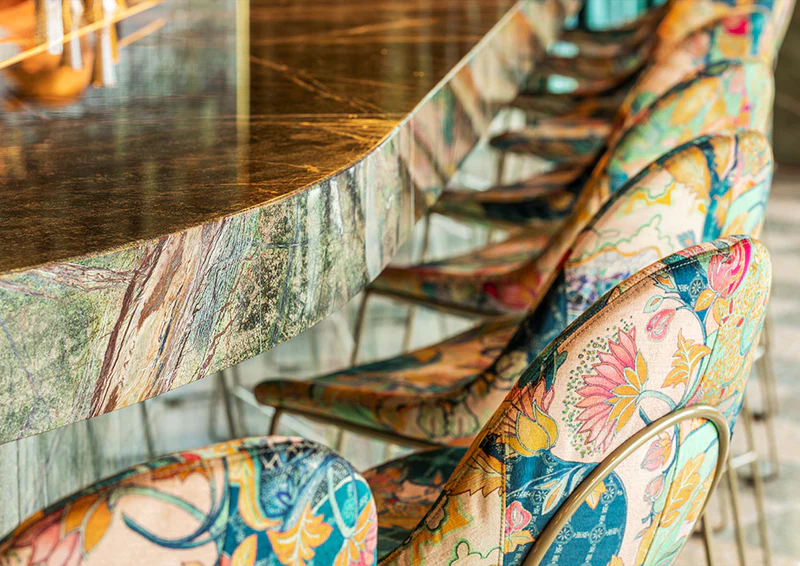 Custom upholstered bar stools at Florattica