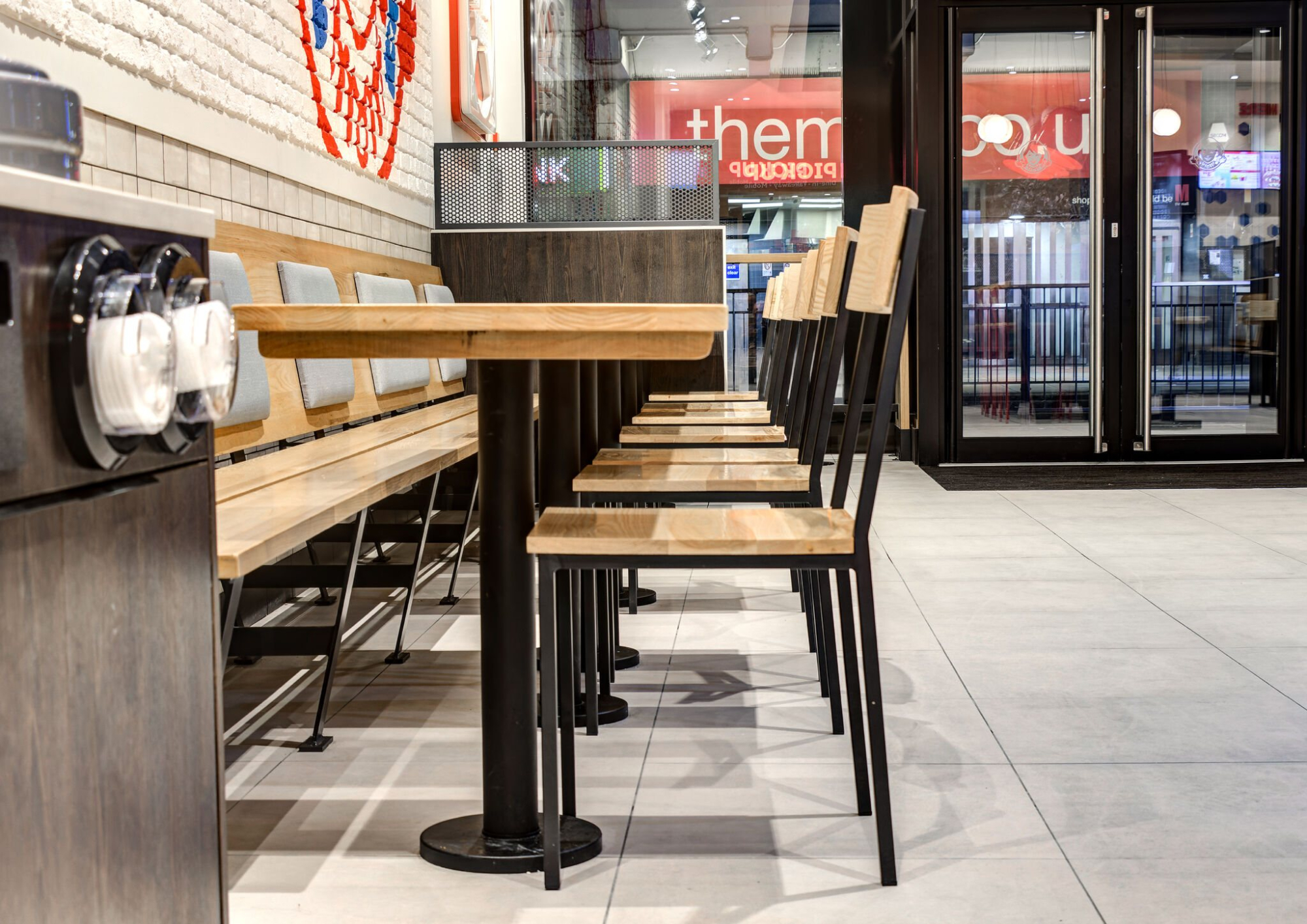 Timber seating and tables at Wendy’s restaurant